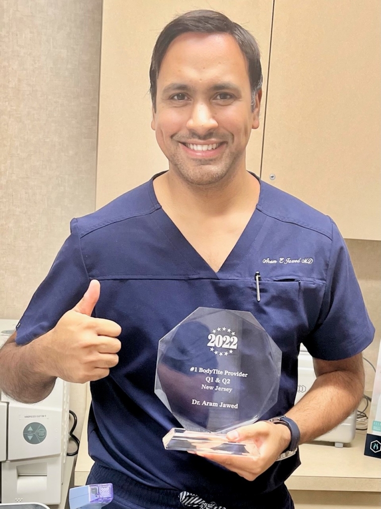 Dr. Aram Jawed with Award